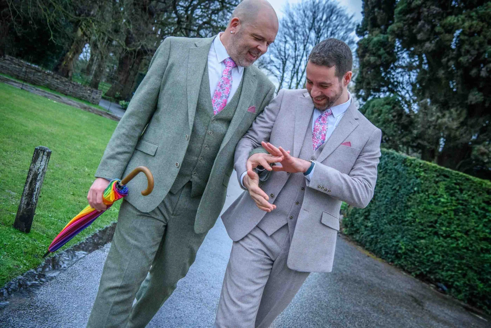 LGBTQ+ wedding photographer documenting two grooms laughing